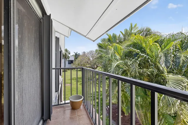 an aerial view of a houses with a swimming pool