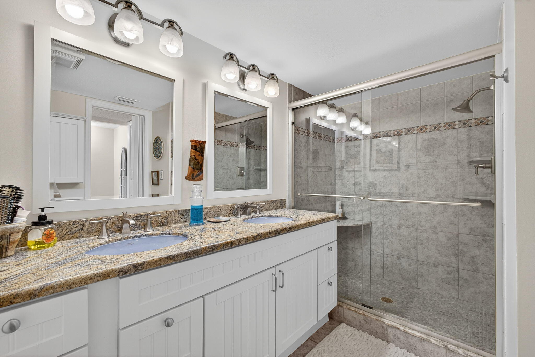 704 Clubhouse Circle Jupiter, FL 33477 - Photo 46 of 72 a bathroom with a granite countertop sink mirror and double