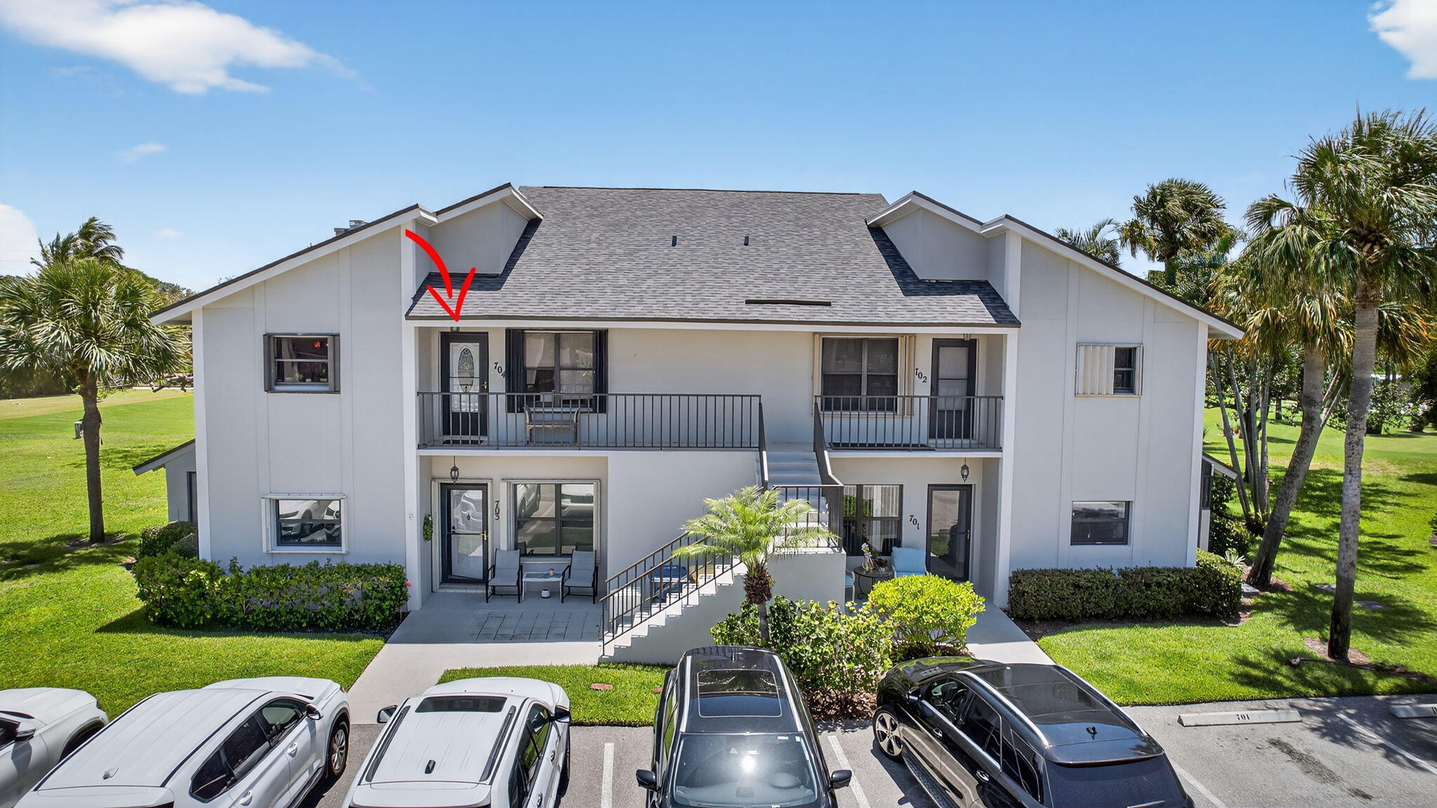 704 Clubhouse Circle Jupiter, FL 33477 - Photo 49 of 72 a front view of house with yard and outdoor seating