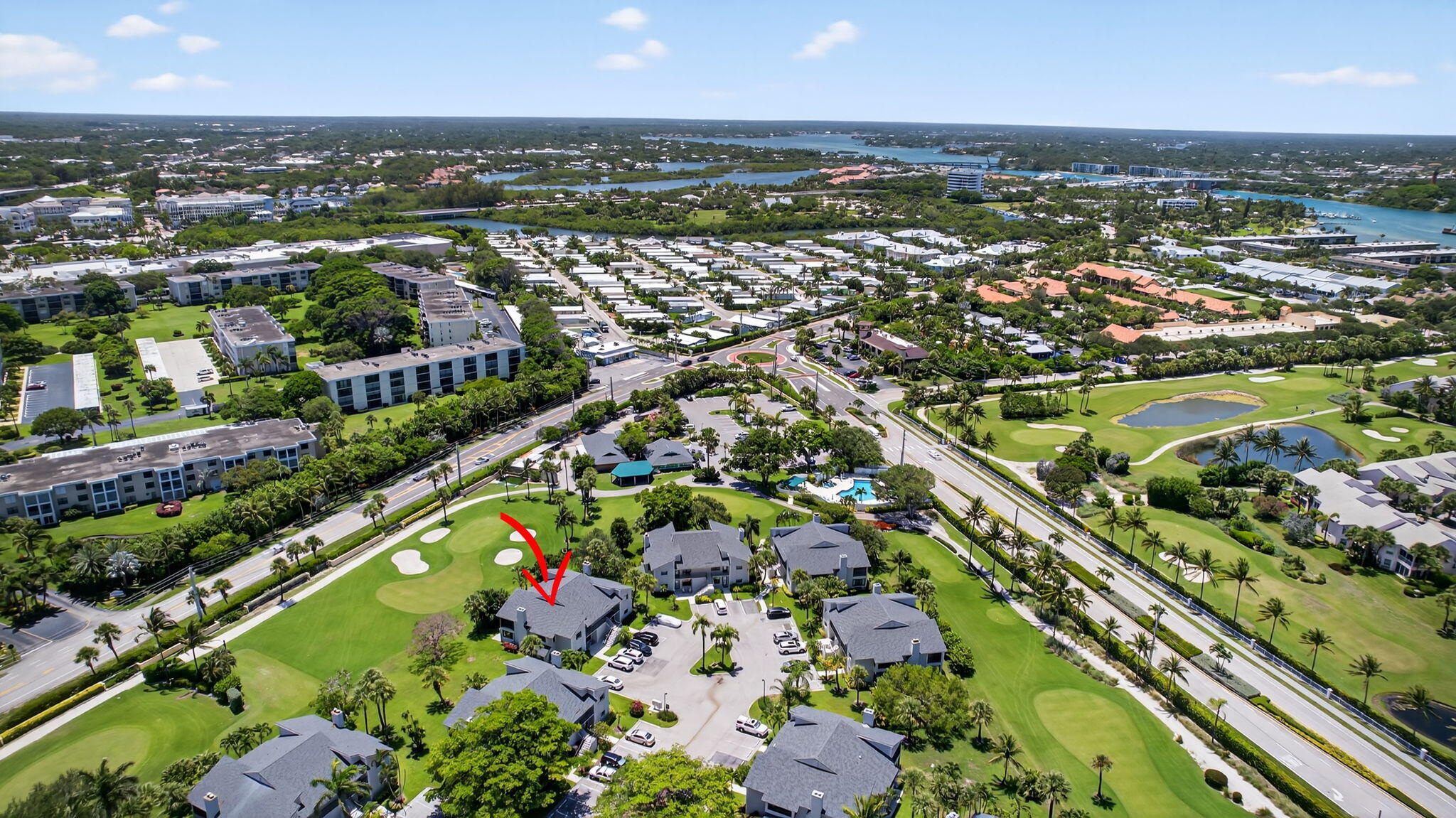 704 Clubhouse Circle Jupiter, FL 33477 - Photo 64 of 72 an aerial view of residential houses with outdoor space