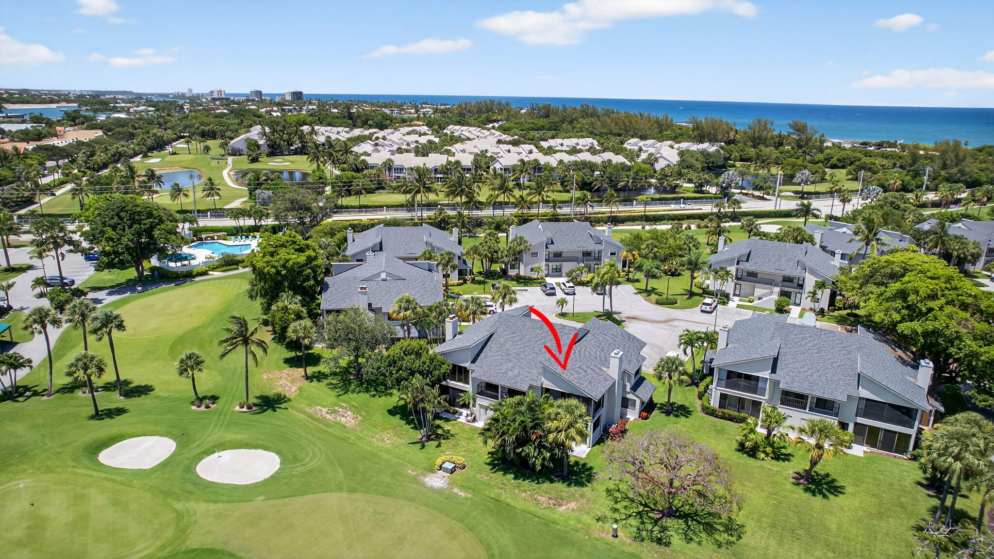704 Clubhouse Circle Jupiter, FL 33477 - Photo 66 of 72 an aerial view of residential houses with outdoor space and lake view