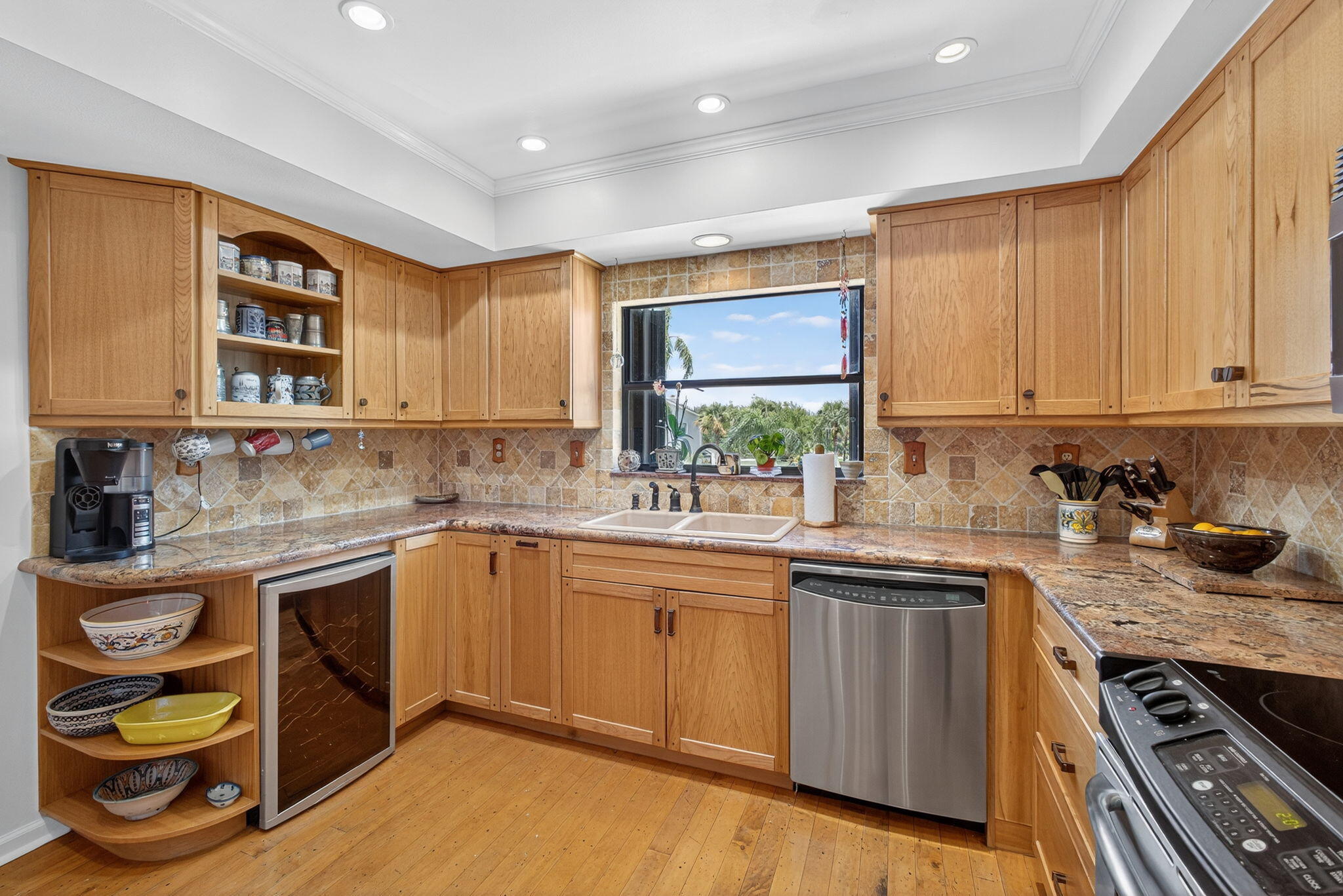 704 Clubhouse Circle Jupiter, FL 33477 - Photo 10 of 72 a kitchen with a sink stove and cabinets