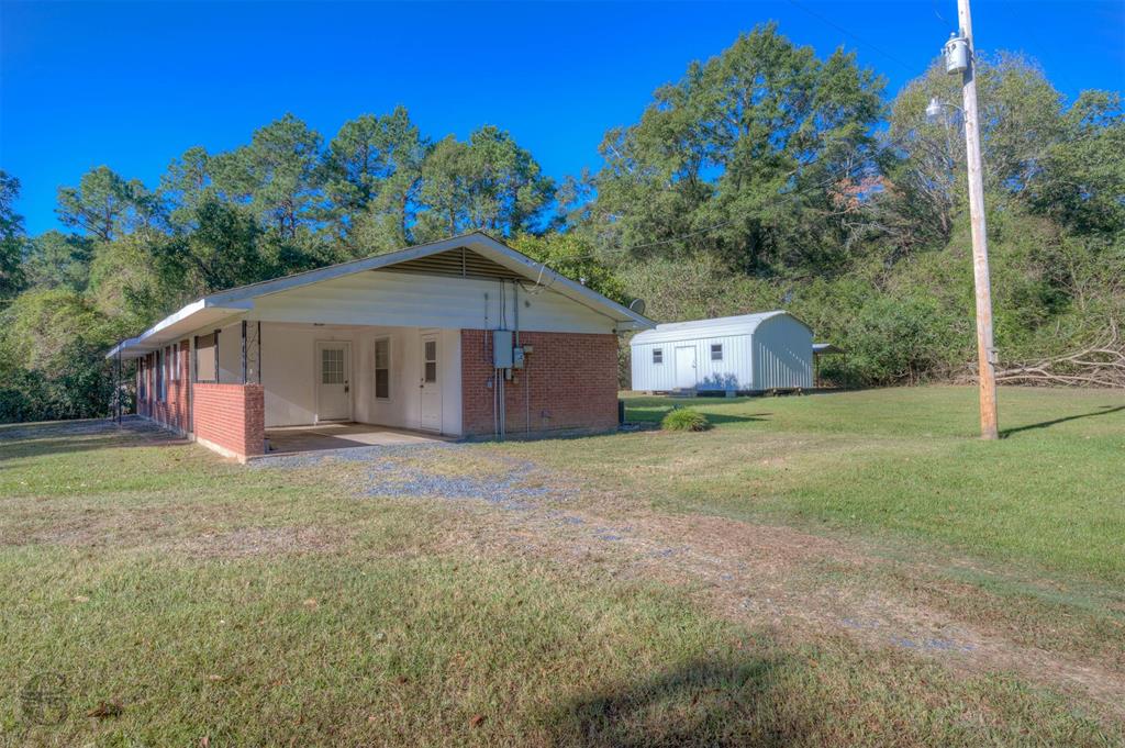 3721 Highway 155 Coushatta, LA 71019 - Photo 6 of 23 a house view with a garden space