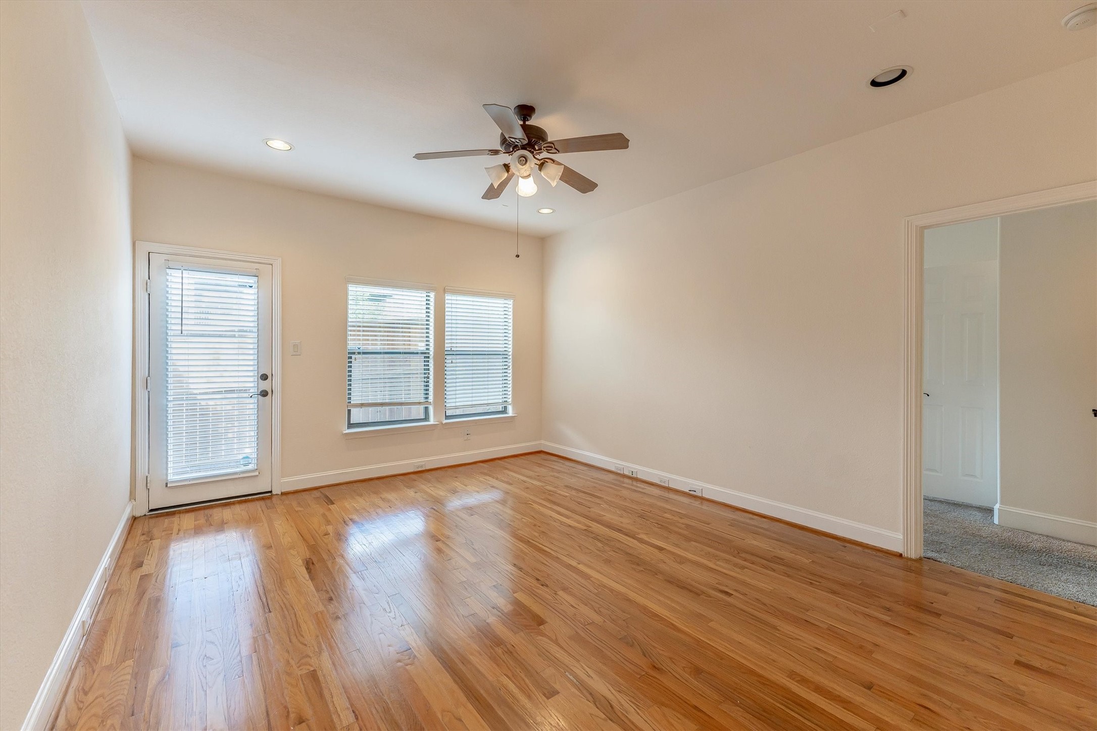 308 Grove Street Houston, TX 77020 - Photo 20 of 28 a view of an empty room with wooden floor and a window