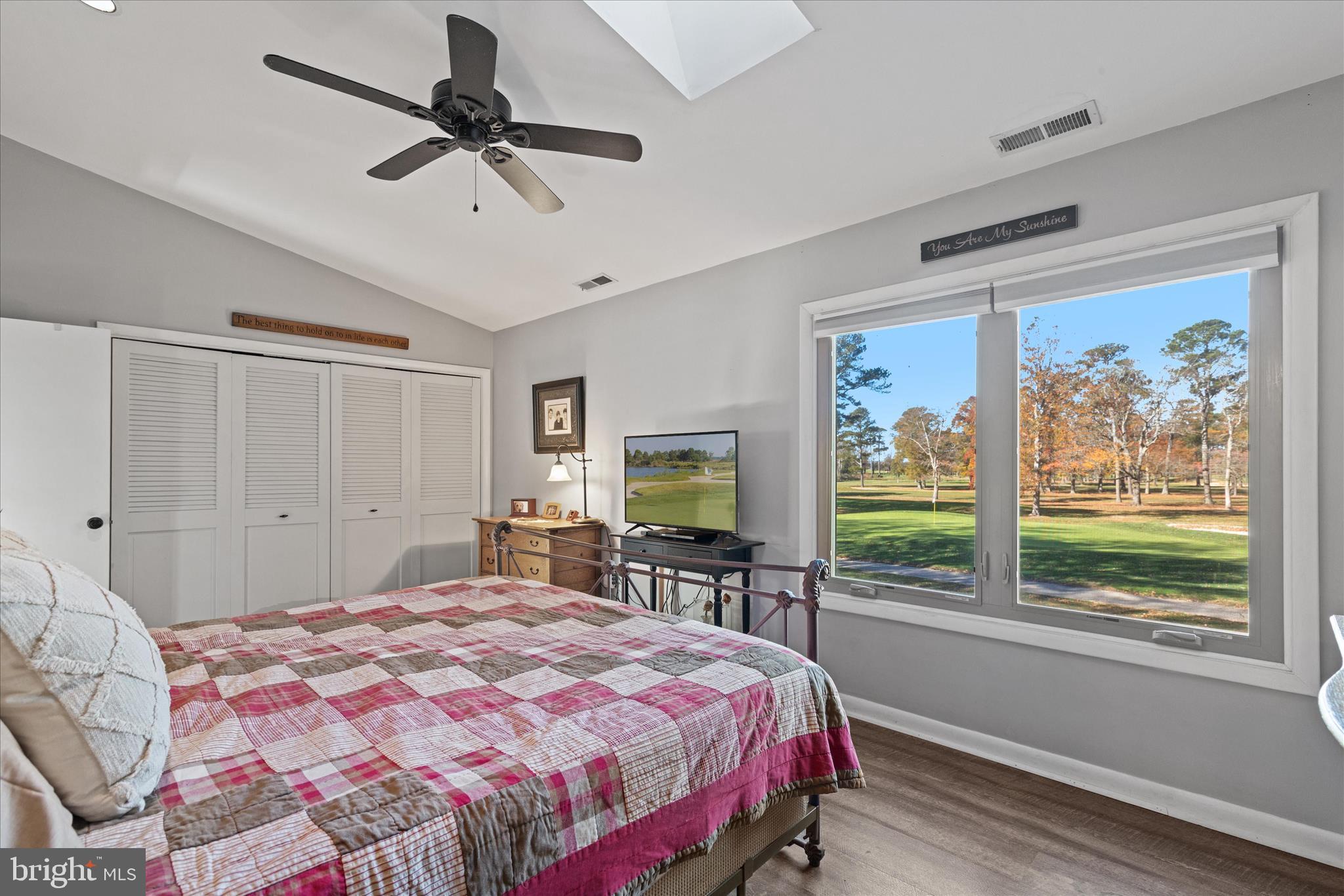 11518 Quillin Way Berlin, MD 21811 - Photo 37 of 65 a bedroom with a bed flat screen tv and a large window