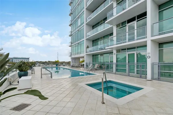 a view of a swimming pool with a lounge chair