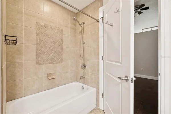 a bathroom with a bathtub and a shower