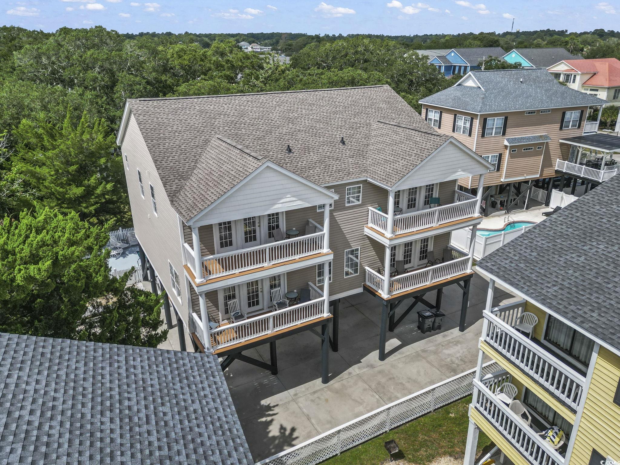 105 B Woodland Drive Murrells Inlet, SC 29576 - Photo 1 of 21 Aerial view of residential area featuring a pool area