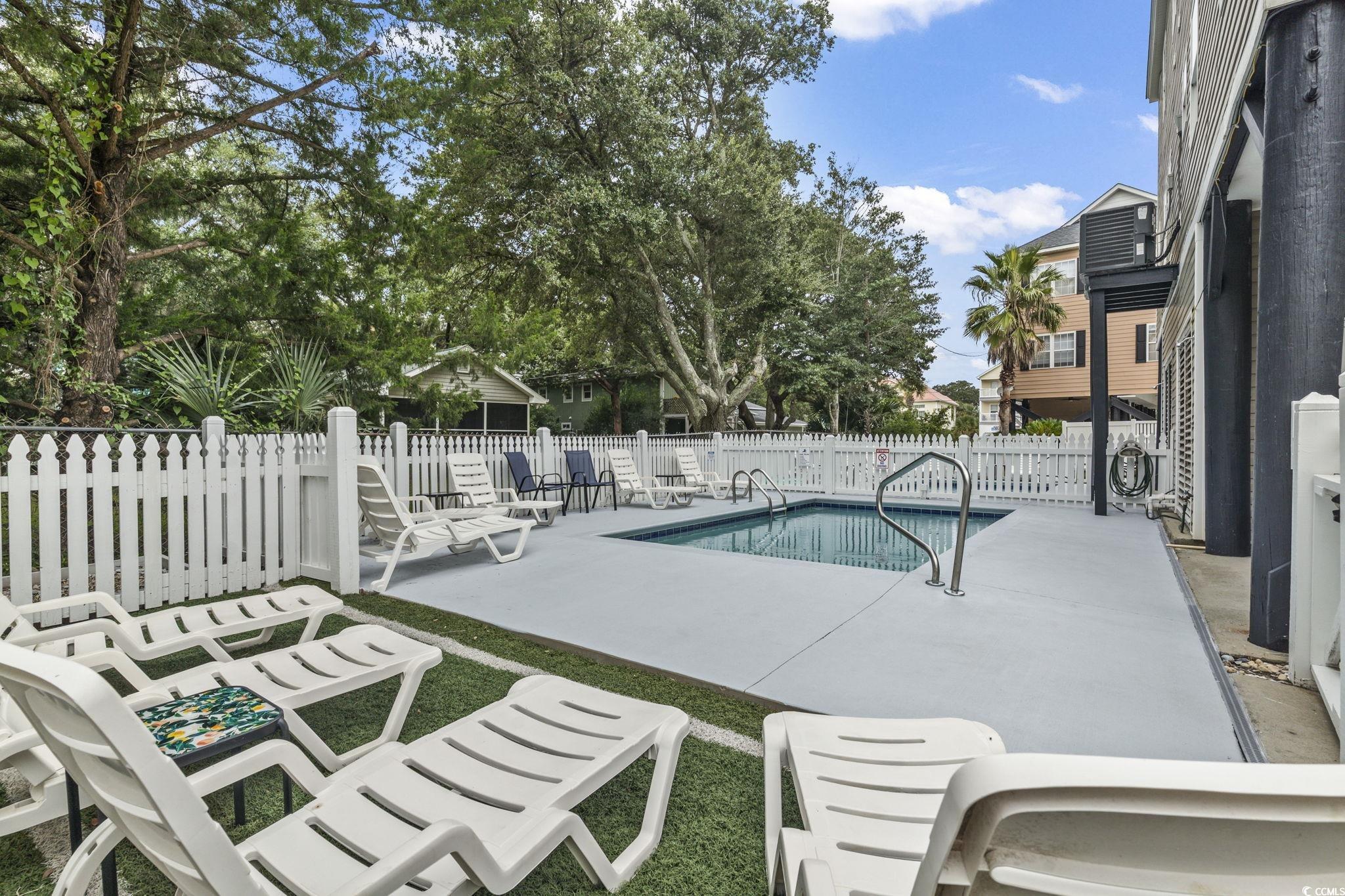 105 B Woodland Drive Murrells Inlet, SC 29576 - Photo 16 of 21 Community pool with a patio