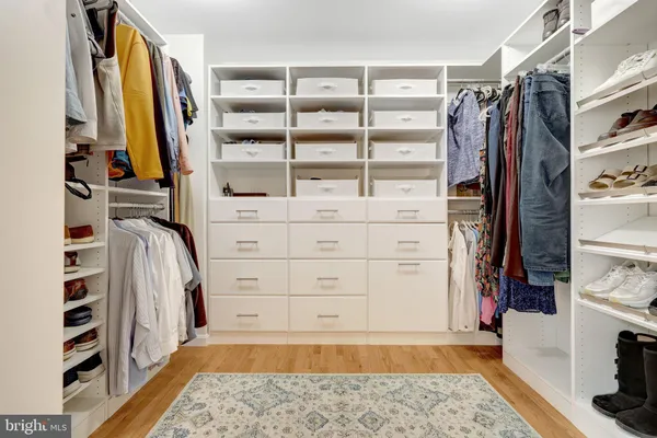 a bath tub sitting next to a white sink