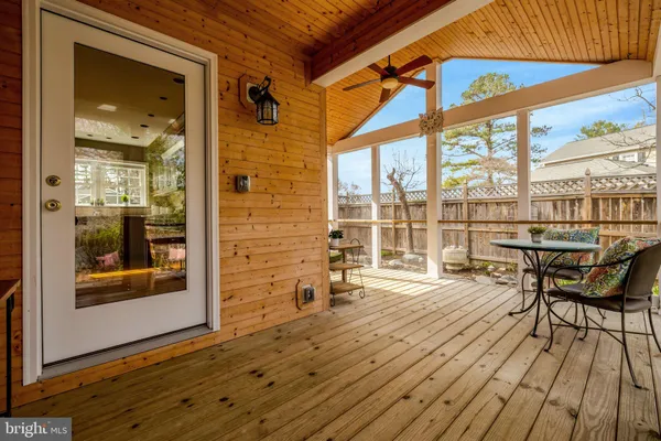 a view of a chairs and table in the balcony