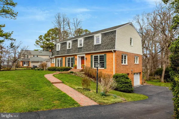 a swimming pool with outdoor seating and yard