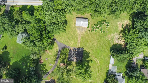 an aerial view of residential house with an outdoor space