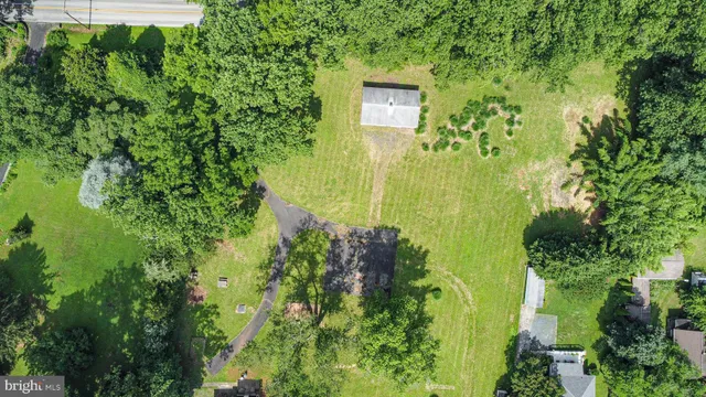 an aerial view of residential house with an outdoor space
