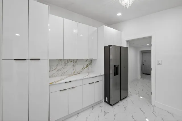 an aerial view of a houses with a yard