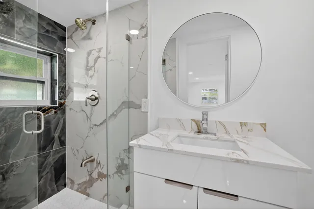 an aerial view of residential building with green space