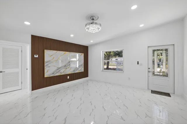 a view of backyard with a garden and trees