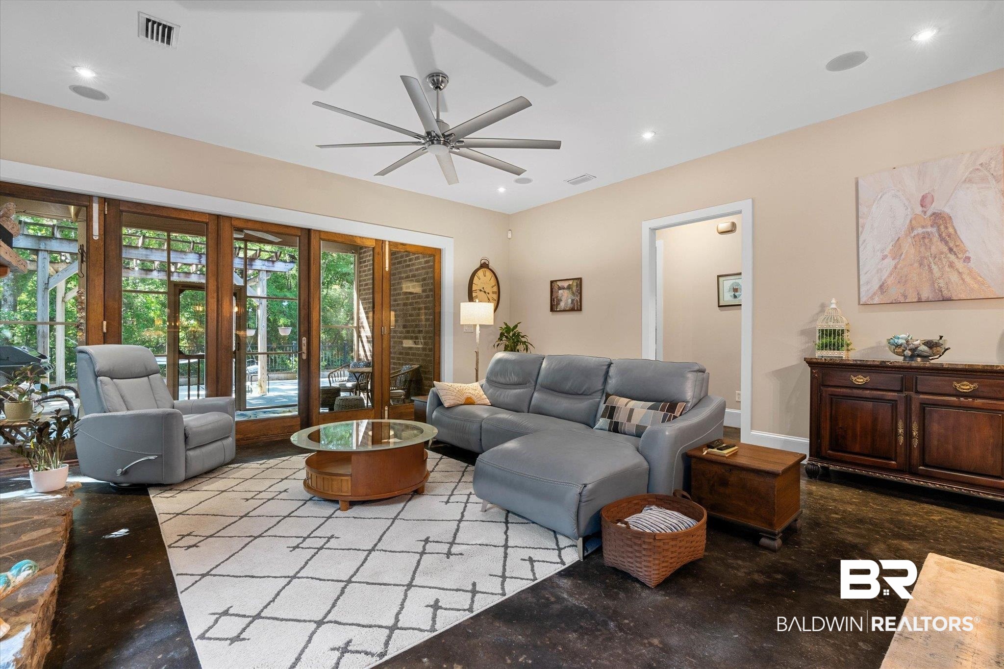 3400 Rue Royal Mobile, AL 36693 - Photo 4 of 33 Living area featuring concrete floors, ceiling fan, and recessed lighting