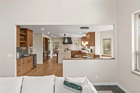 a kitchen with a large window sink and cabinets