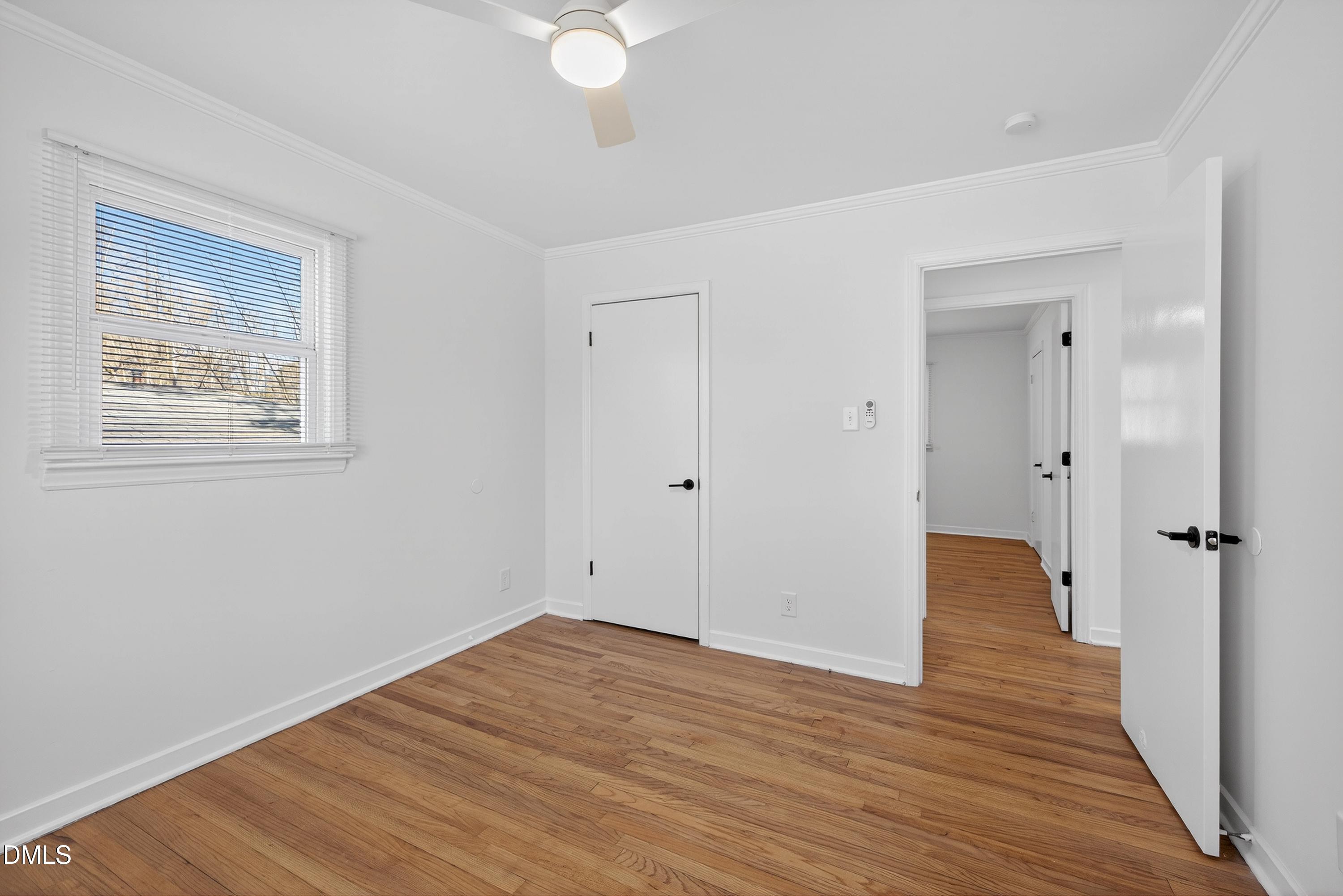 302 Normandy Street Durham, NC 27707 - Photo 26 of 29 a view of an empty room with wooden floor