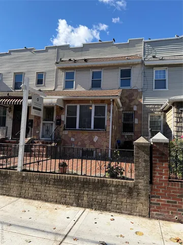 a front view of a house with glass windows