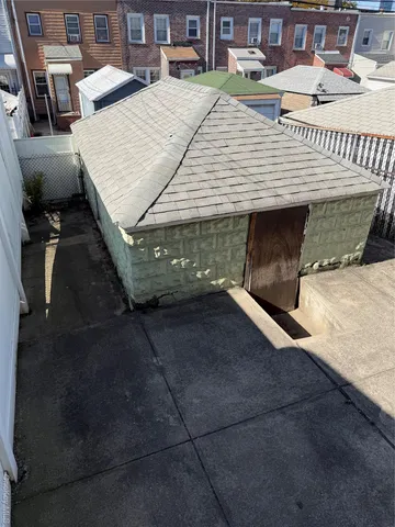 a picture of a patio with table and chairs