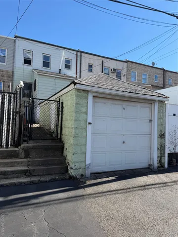 a view of a house with a stairs and wooden stairs