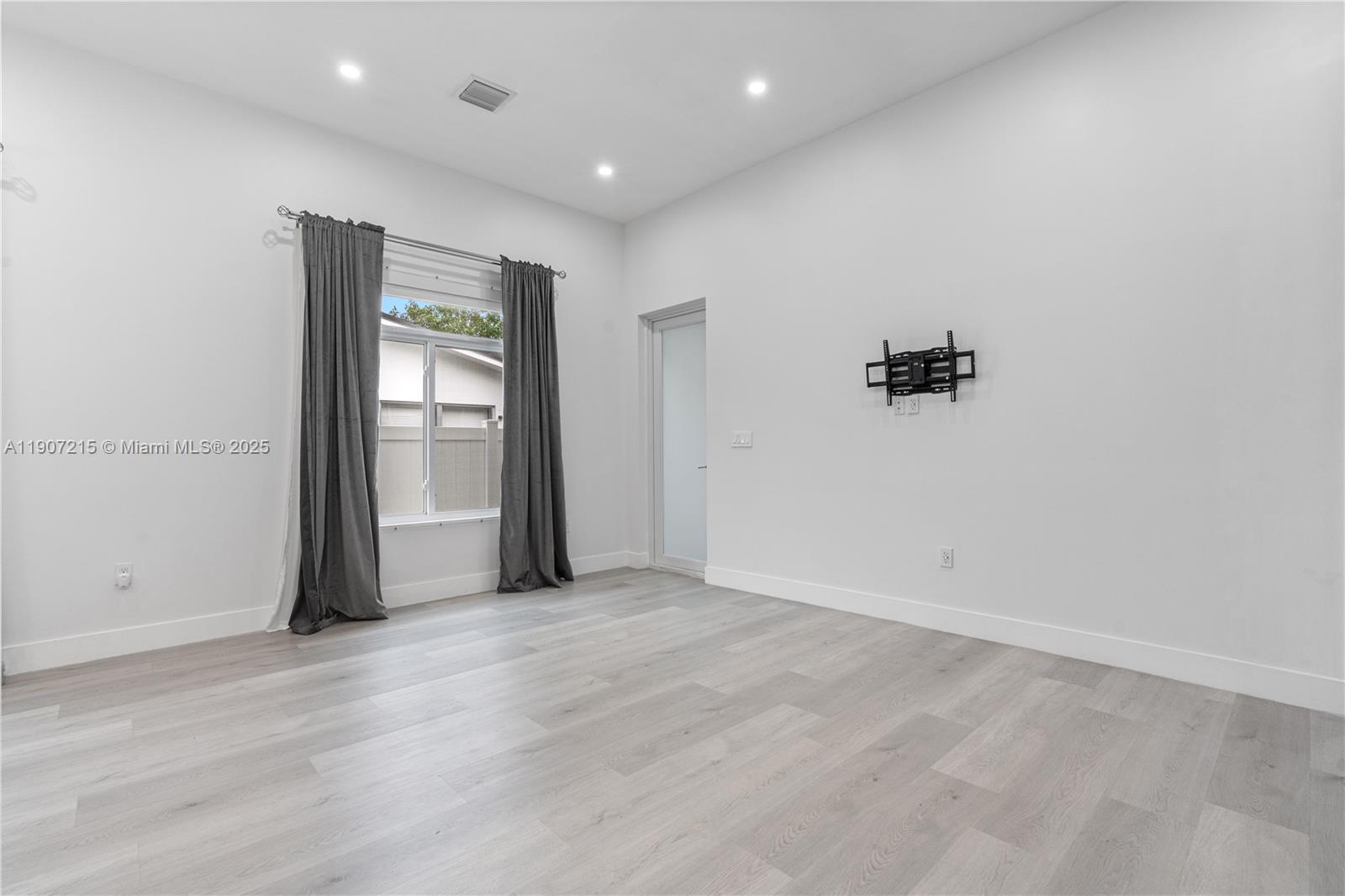 5734 Buchanan Street, Unit B Hollywood, FL 33021 - Photo 12 of 21 an empty room with cabinet and mirrors