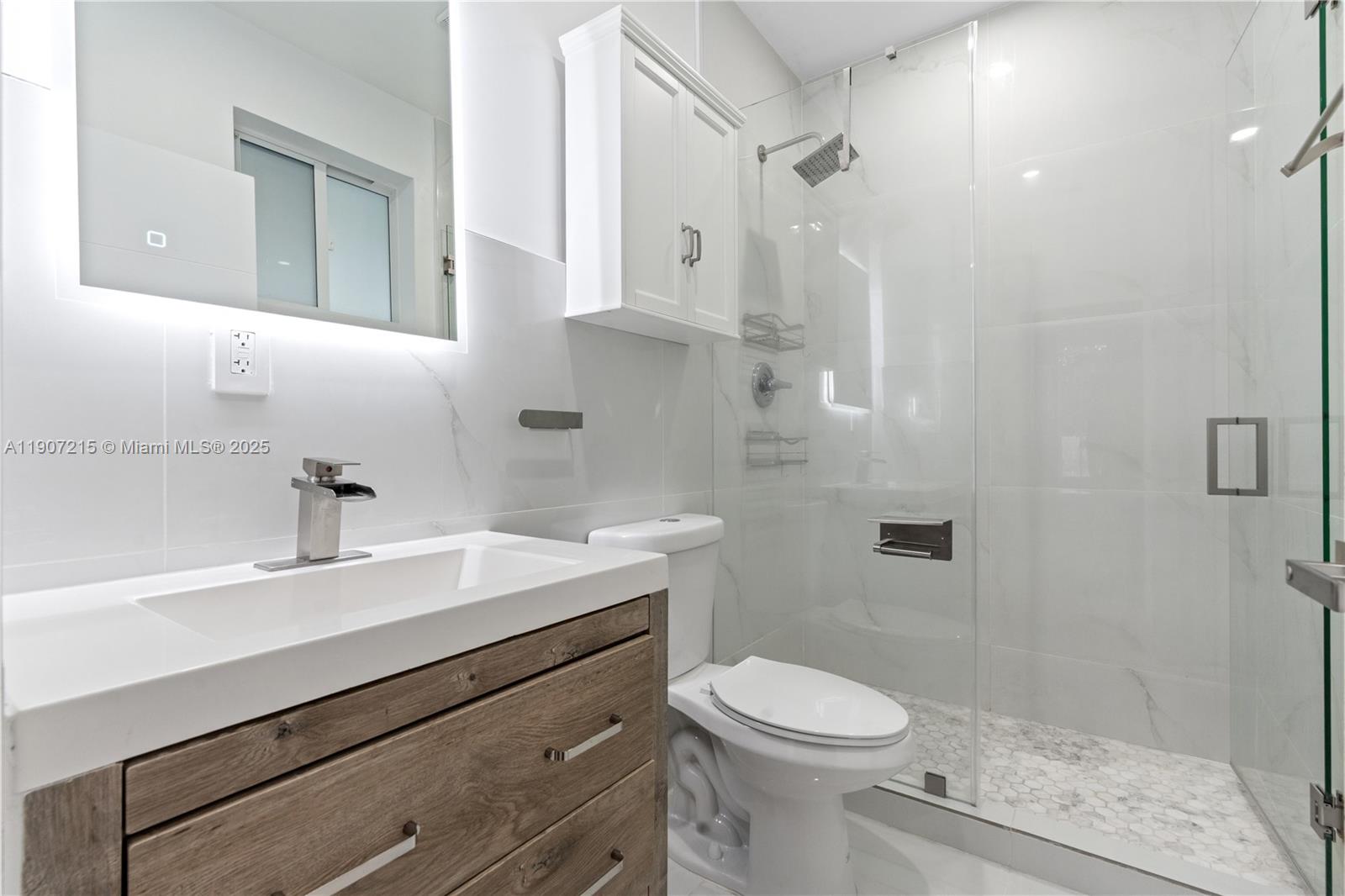5734 Buchanan Street, Unit B Hollywood, FL 33021 - Photo 13 of 21 a bathroom with a sink a toilet and shower