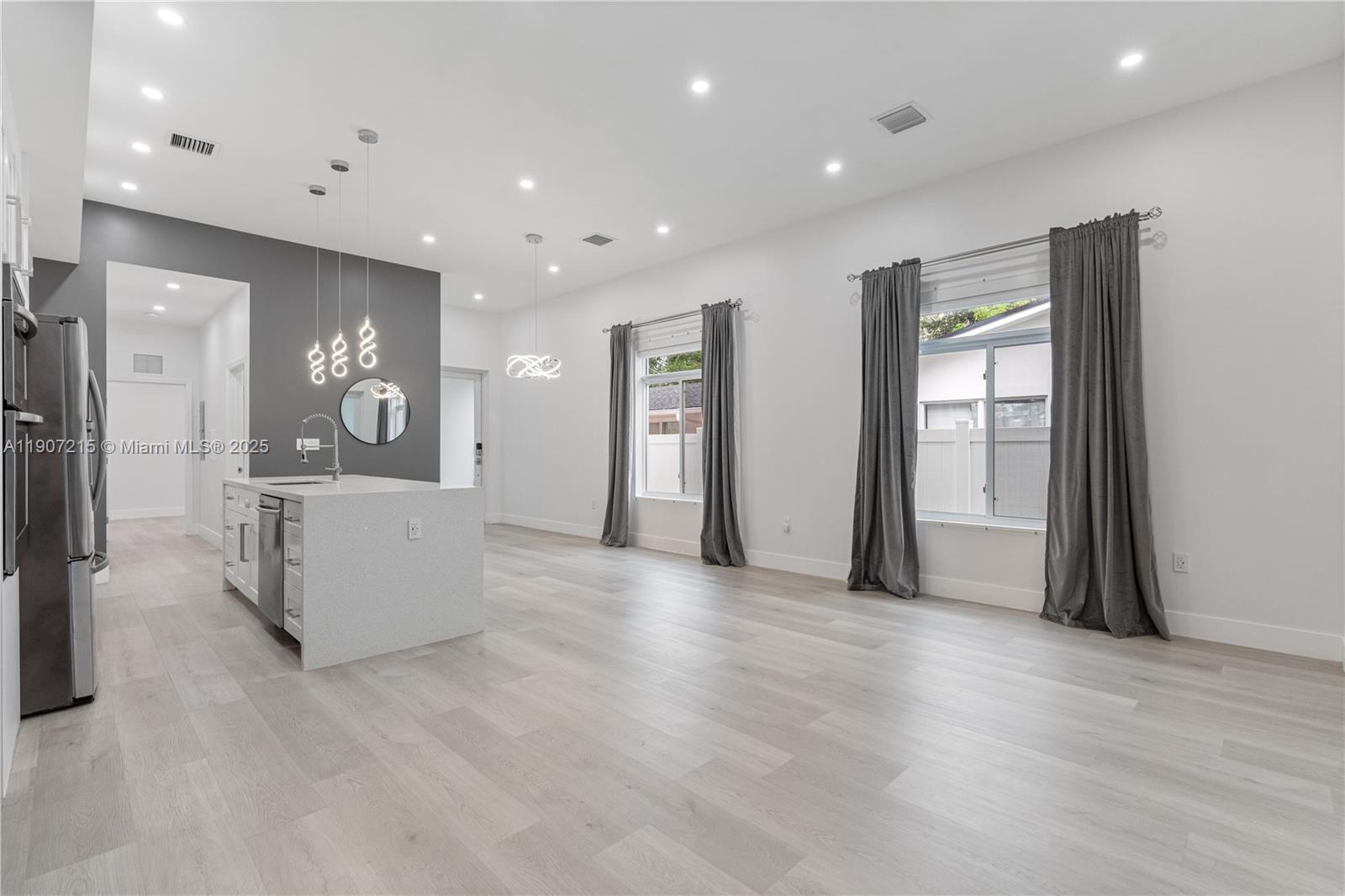 5734 Buchanan Street, Unit B Hollywood, FL 33021 - Photo 7 of 21 a view of a kitchen with refrigerator and windows