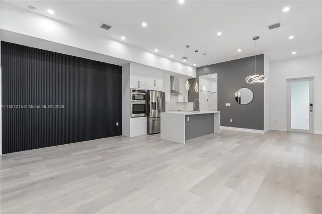 a view of a kitchen with a sink