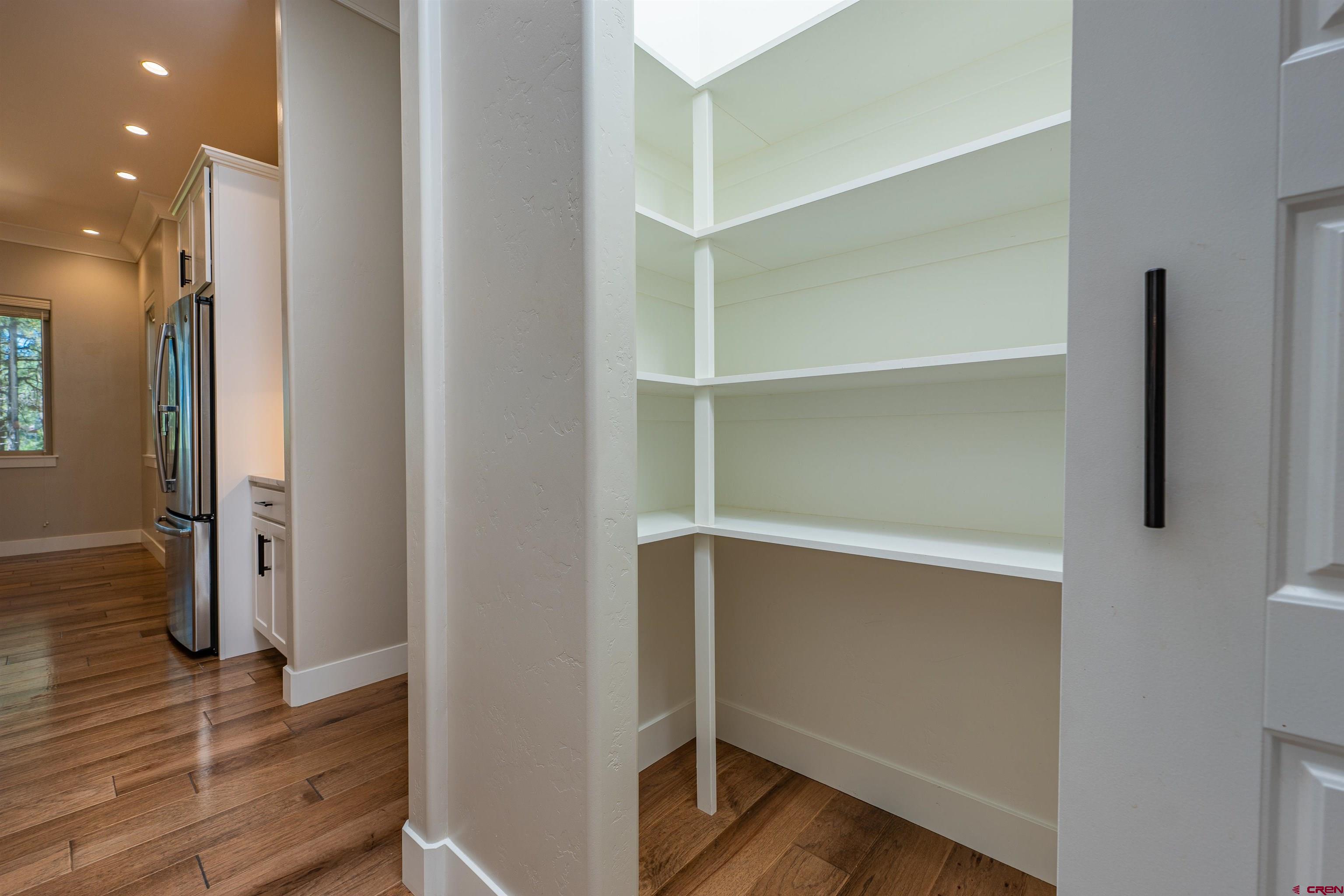 324 Hay Barn Road Durango, CO 81301 - Photo 11 of 35 a view of walk in closet with wooden floor