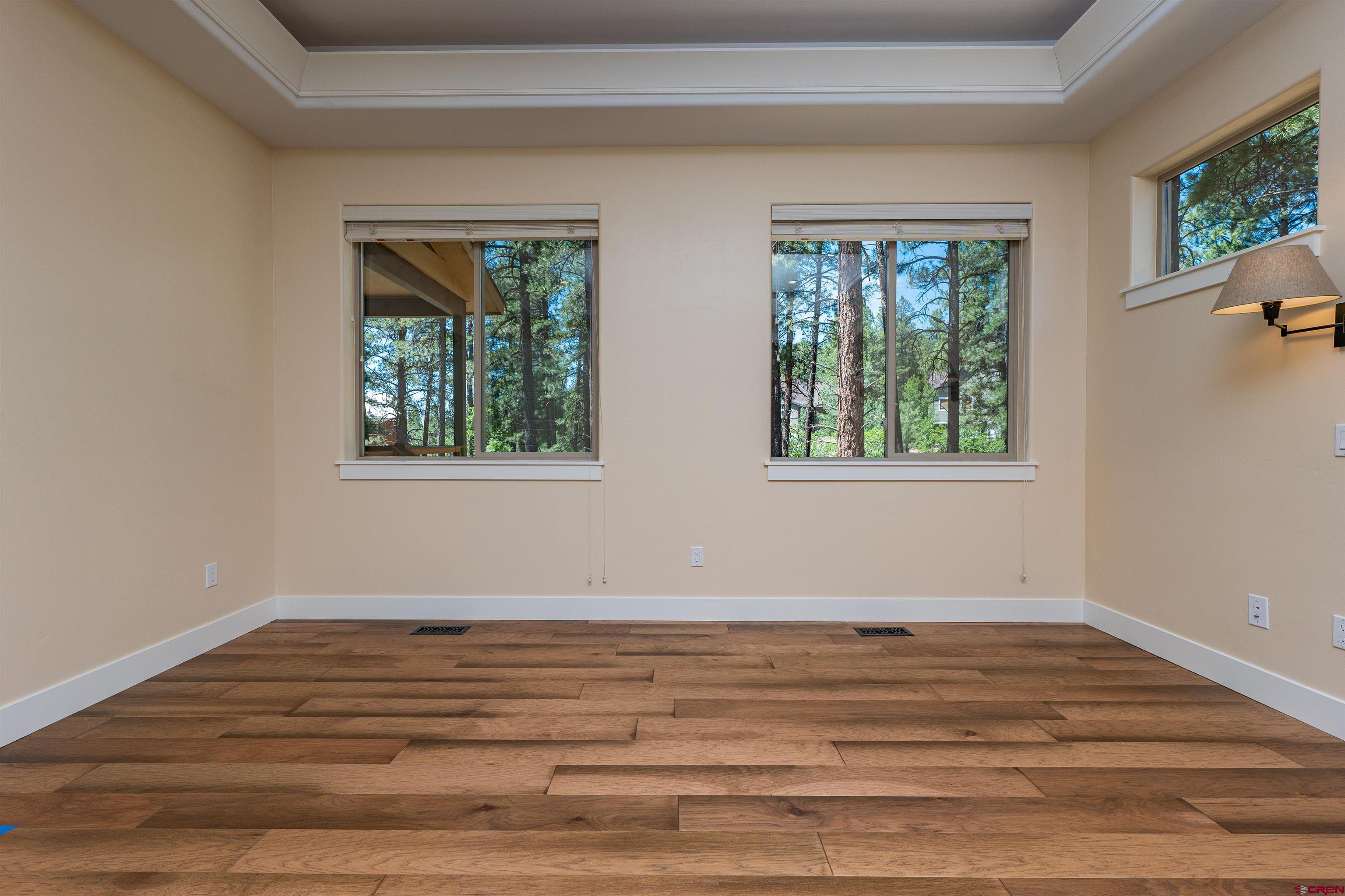 324 Hay Barn Road Durango, CO 81301 - Photo 19 of 35 a view of a room with wooden floor and window