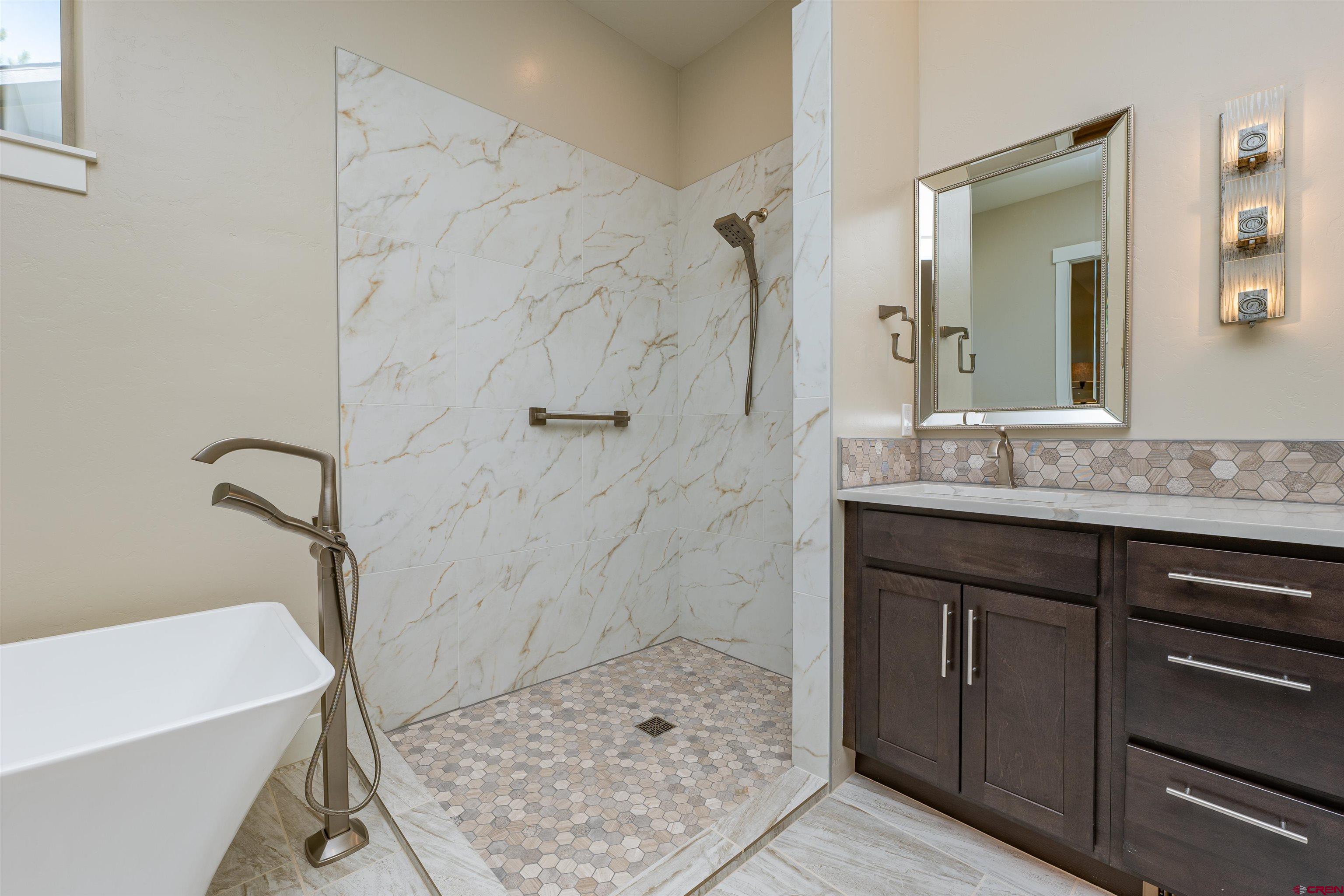 324 Hay Barn Road Durango, CO 81301 - Photo 21 of 35 a bathroom with a sink a toilet and shower