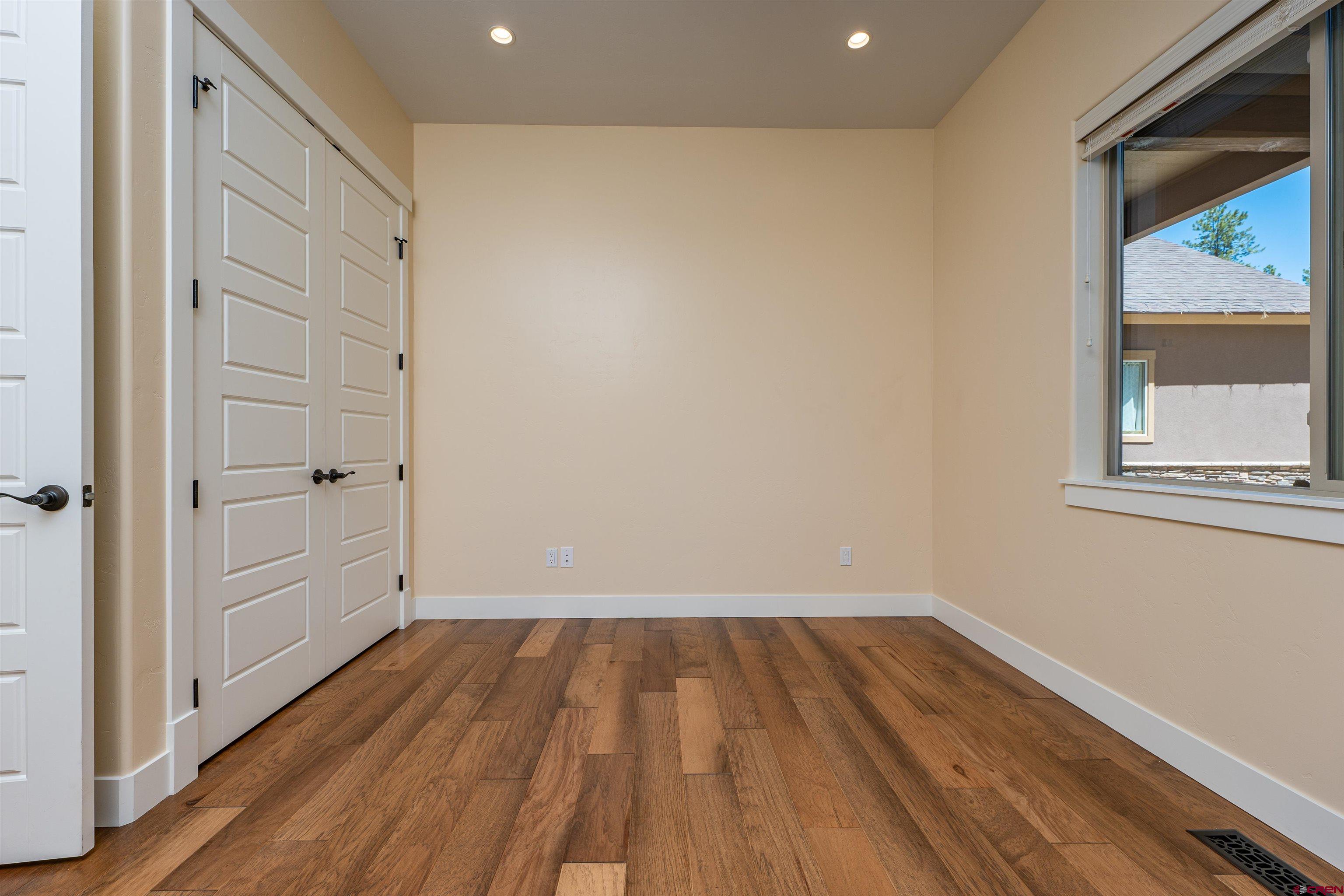 324 Hay Barn Road Durango, CO 81301 - Photo 28 of 35 a view of a room with wooden floor and window