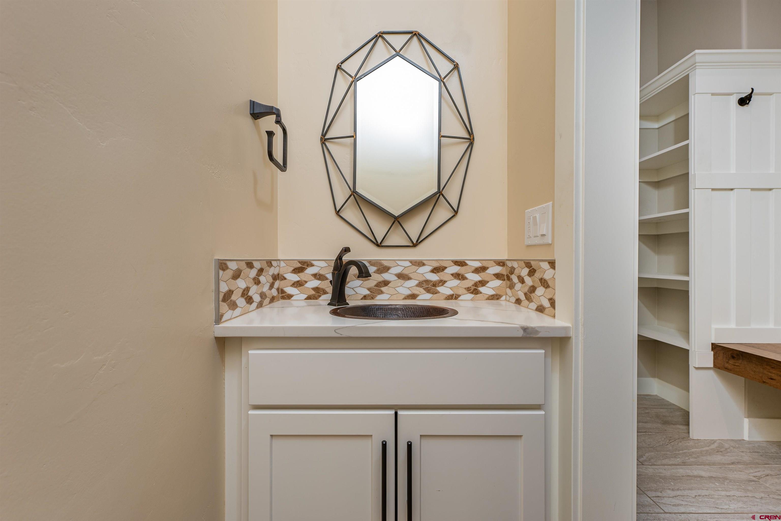 324 Hay Barn Road Durango, CO 81301 - Photo 30 of 35 a bathroom with a sink and a mirror