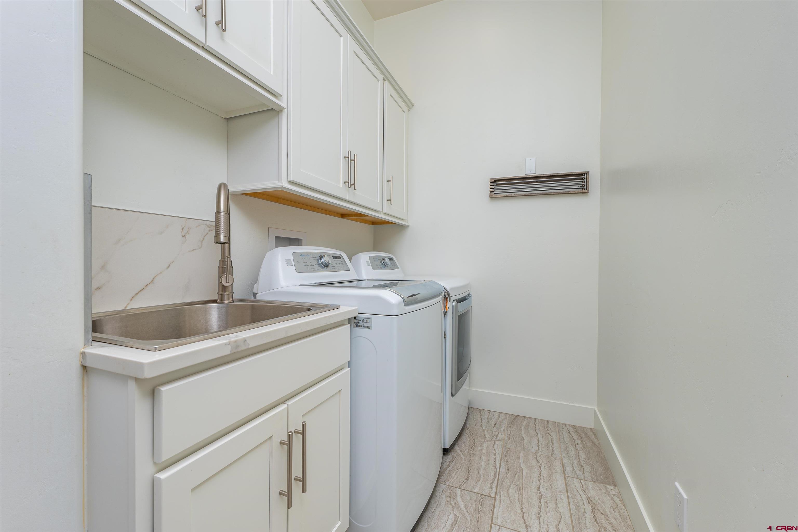 324 Hay Barn Road Durango, CO 81301 - Photo 31 of 35 a utility room with dryer and washer