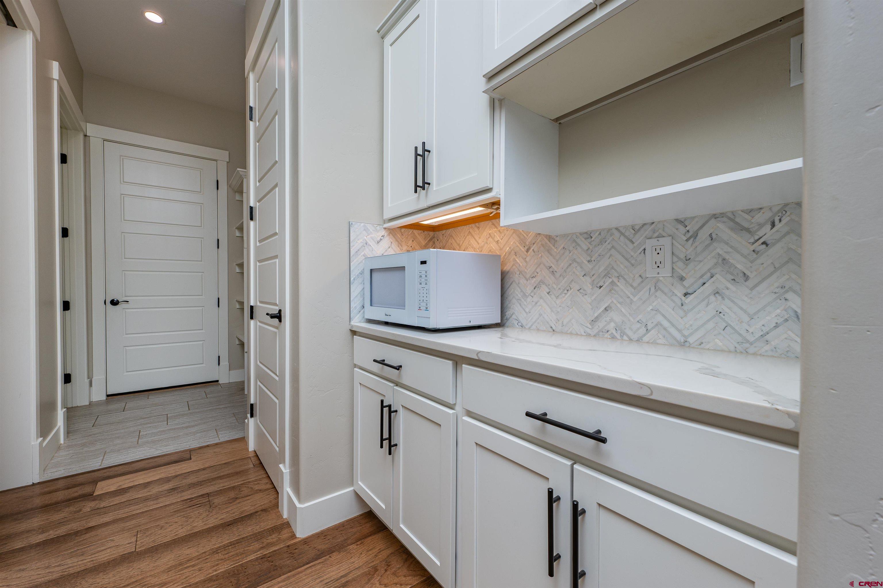 324 Hay Barn Road Durango, CO 81301 - Photo 10 of 35 a kitchen with stainless steel appliances a refrigerator and a stove top oven