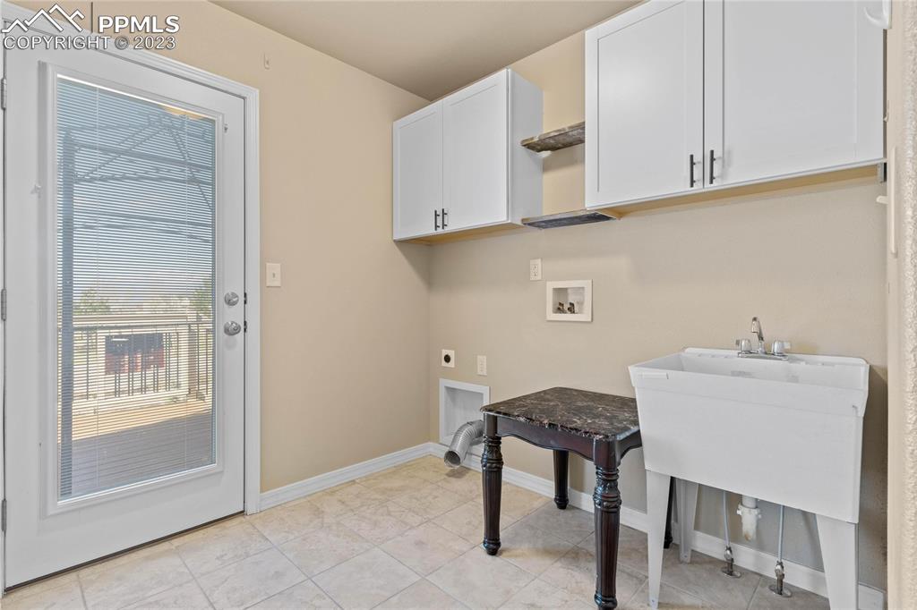 2423 Cinnabar Road Colorado Springs, CO 80921 - Photo 16 of 40 Just off the kitchen is spacious laundry room with walk out to back deck.
