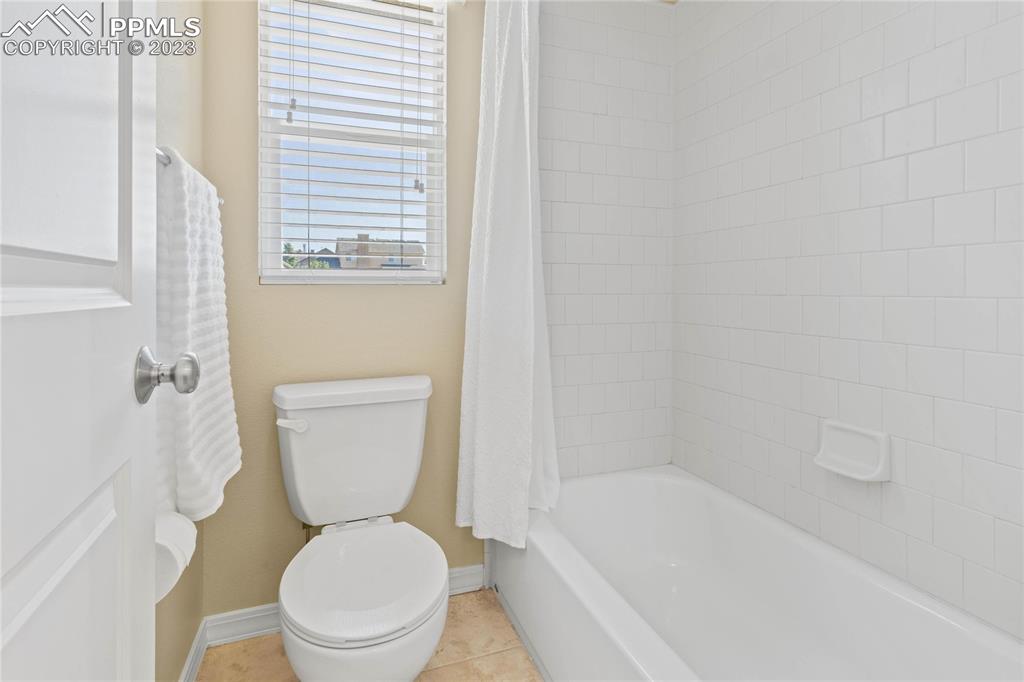 2423 Cinnabar Road Colorado Springs, CO 80921 - Photo 27 of 40 a white toilet sitting next to a bath tub