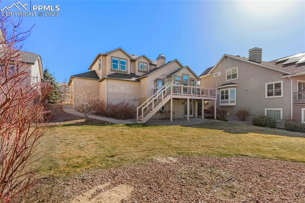 2423 Cinnabar Road Colorado Springs, CO 80921 - Photo 34 of 40 a view of a house with a yard