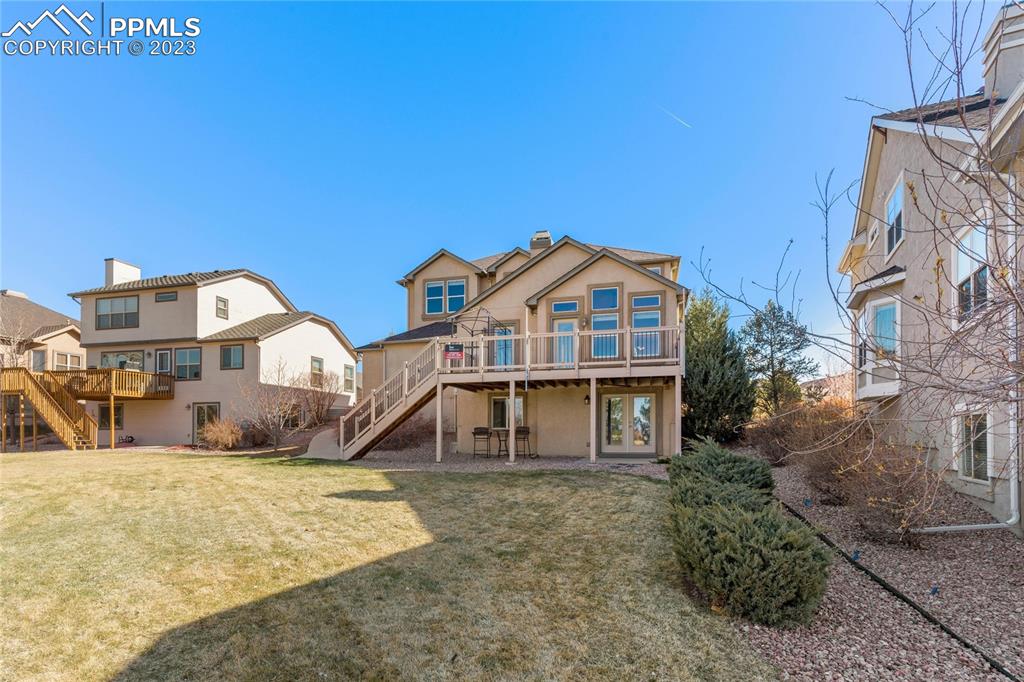 2423 Cinnabar Road Colorado Springs, CO 80921 - Photo 35 of 40 a front view of a house with a yard