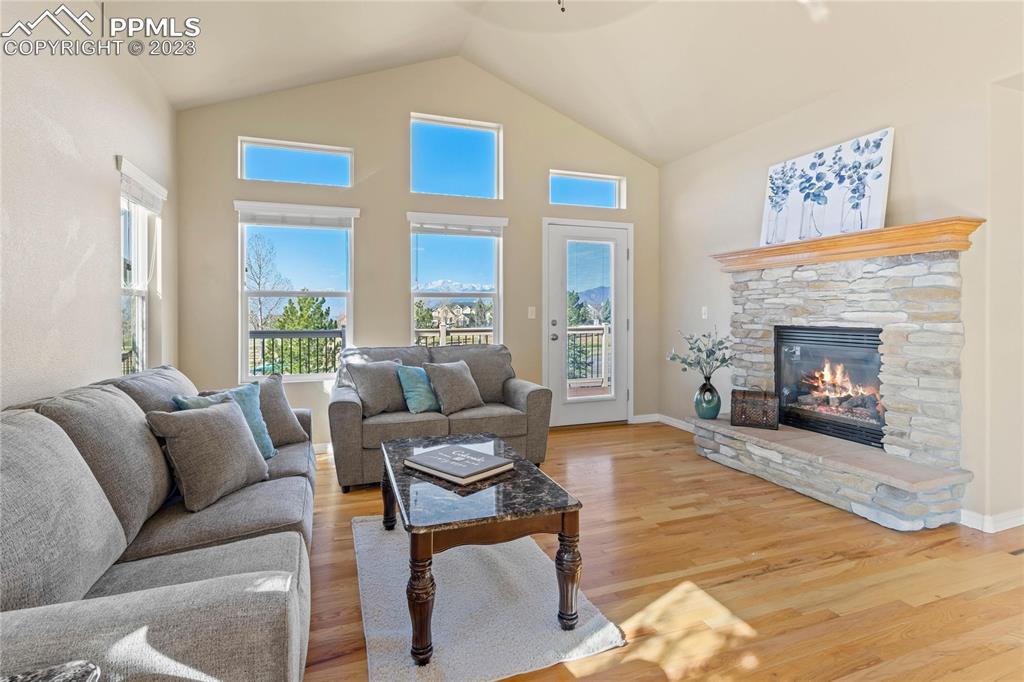 2423 Cinnabar Road Colorado Springs, CO 80921 - Photo 6 of 40 a living room with furniture and a fireplace