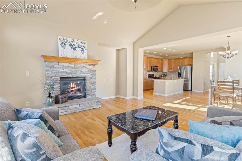 2423 Cinnabar Road Colorado Springs, CO 80921 - Photo 8 of 40 Main level is open concept perfect for entertaining and features hardwood flooring throughout.