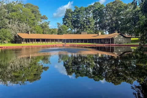 a view of a lake with a house in the background