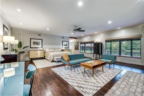a living room with lots of furniture and a rug