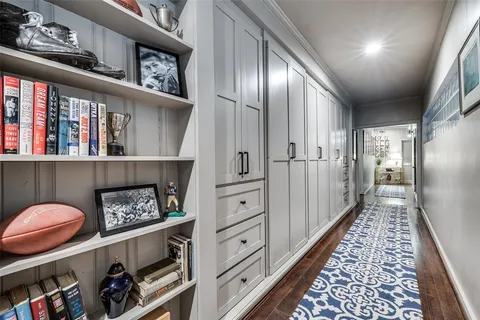 a view of a hallway with seating space