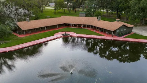 a view of a wooden deck with a lake view