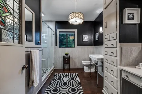 a bathroom with a shower and a sink