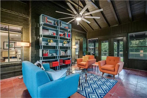 a outdoor living space with furniture and a fireplace